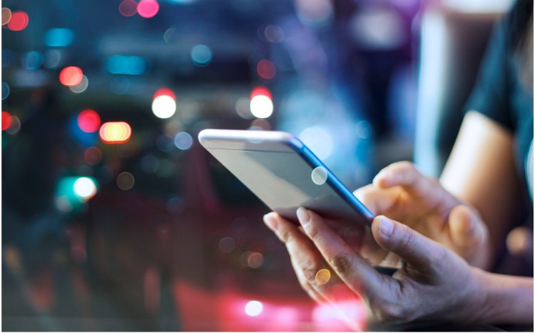 EIG adjuster capturing photos on a phone